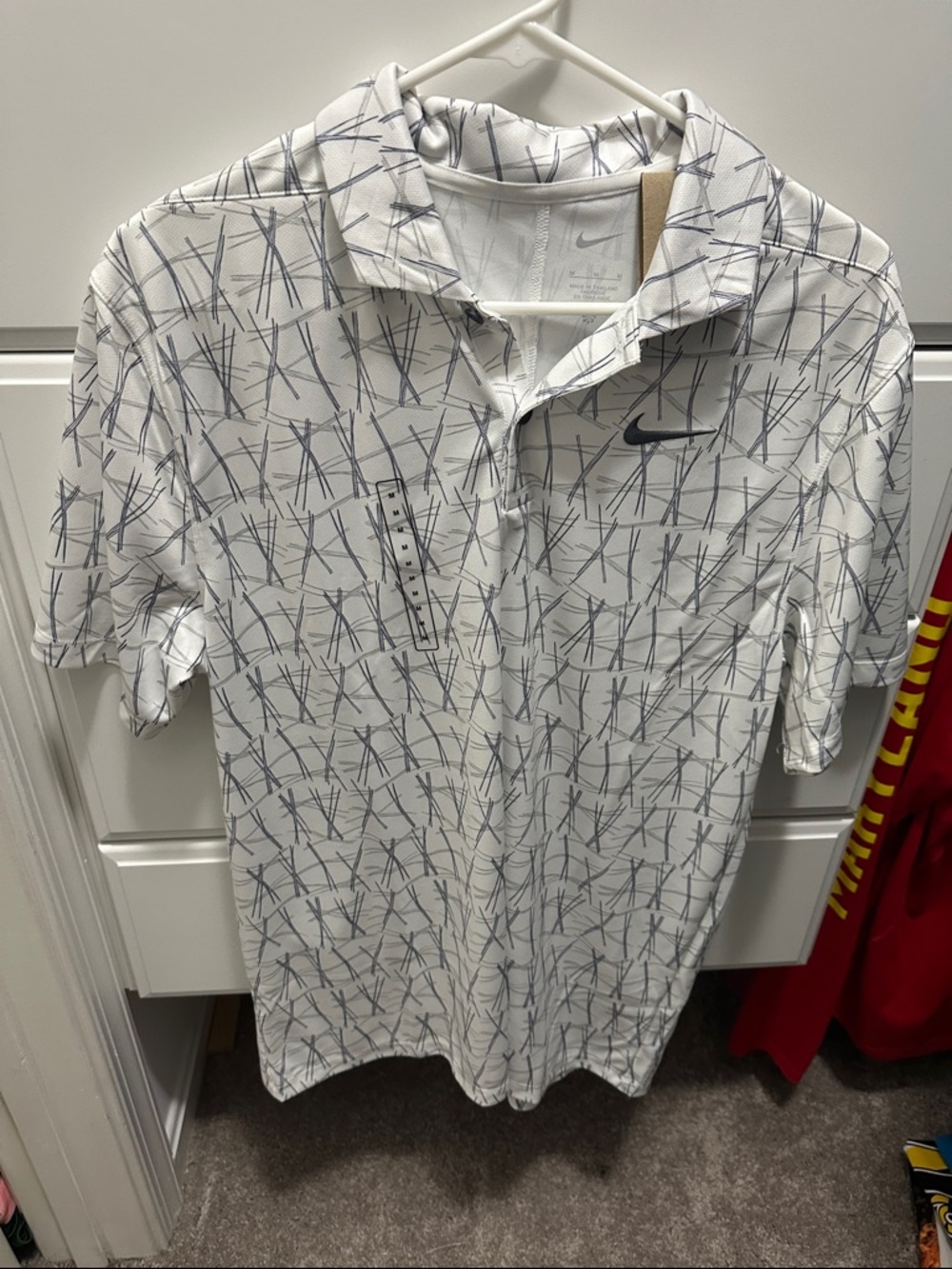Nike Golf White Polo with Navy Abstract Line Print. Brand new with tags